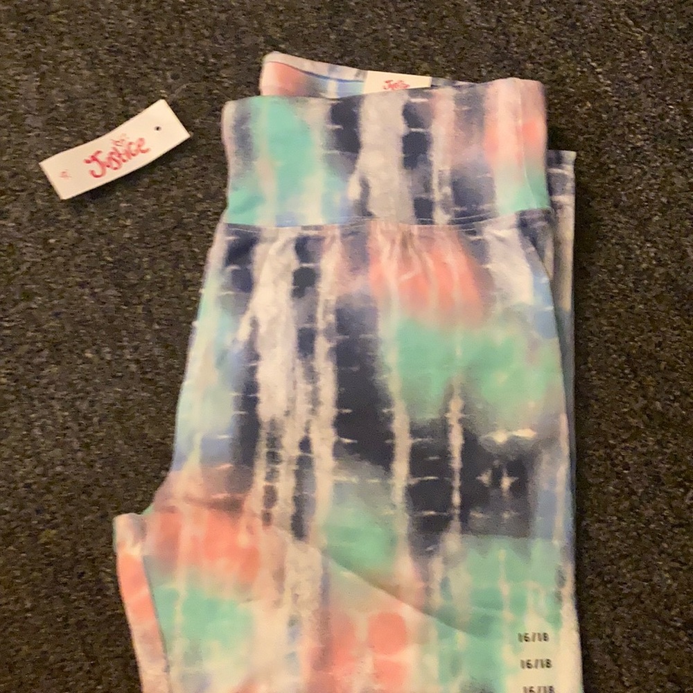 Justice full length purple,teal, and pink leggings. Size 16/18